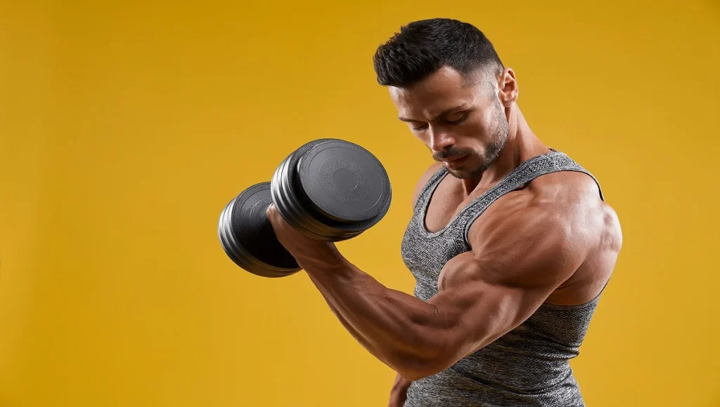 man performing forearm workout with dumbbells for bigger and stronger arms